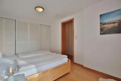 Ein Bett oder Betten in einem Zimmer der Unterkunft Ferienhaus Aalweg