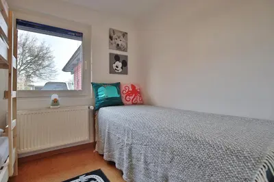 Ein Bett oder Betten in einem Zimmer der Unterkunft Ferienhaus Aalweg