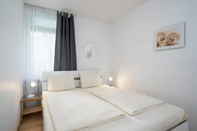 Ein Bett oder Betten in einem Zimmer der Unterkunft HOF 114 - Berliner Hof - Seeblick