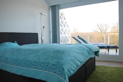 Ein Bett oder Betten in einem Zimmer der Unterkunft Riv 45 - Riviera - mit Außenschwimmbad