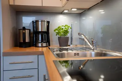 Küche/Küchenzeile in der Unterkunft TER 215 - Terrassenhuegel - Seeblick