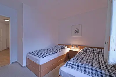Ein Bett oder Betten in einem Zimmer der Unterkunft BER 511 - Appartementresidenz