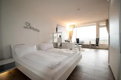 Ein Bett oder Betten in einem Zimmer der Unterkunft Plaza Premium Timmendorfer Strand Schöne Aussicht 285