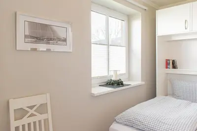 Ein Bett oder Betten in einem Zimmer der Unterkunft Ferienwohnung Lille Sand 1