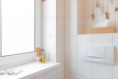 Ein Badezimmer in der Unterkunft Ferienwohnung Lille Sand 2