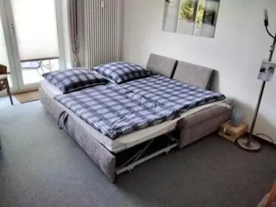 Ein Bett oder Betten in einem Zimmer der Unterkunft Haus Stranddüne MeerZeit Haffkrug