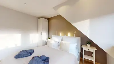 Ein Bett oder Betten in einem Zimmer der Unterkunft Baltic Pearl