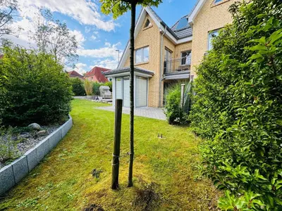 Ein Garten an der Unterkunft Sealect-Hus 4 Timmendorfer Strand, mit Sauna