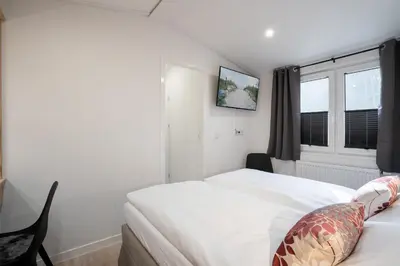 Ein Bett oder Betten in einem Zimmer der Unterkunft Ostseecamp Ferienhaus 