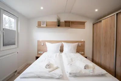 Ein Bett oder Betten in einem Zimmer der Unterkunft Ostseecamp Casa de la Playa