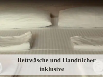 Ein Bett oder Betten in einem Zimmer der Unterkunft Waldstrandnest mit Weitblick