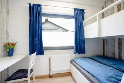 Ein Bett oder Betten in einem Zimmer der Unterkunft AMW8d Ferienhaus Moin