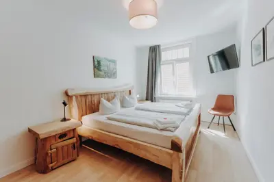 Ein Bett oder Betten in einem Zimmer der Unterkunft Apartments im Herzen Lübecks