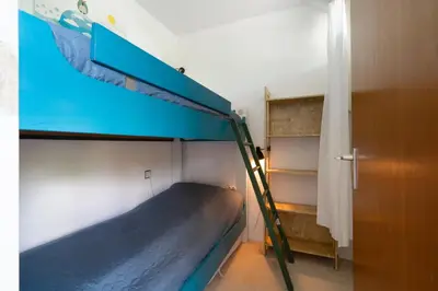 Ein Etagenbett oder Etagenbetten in einem Zimmer der Unterkunft Ferienpark Sierksdorf App 180