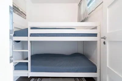 Ein Etagenbett oder Etagenbetten in einem Zimmer der Unterkunft Ferienpark Sierksdorf App 148