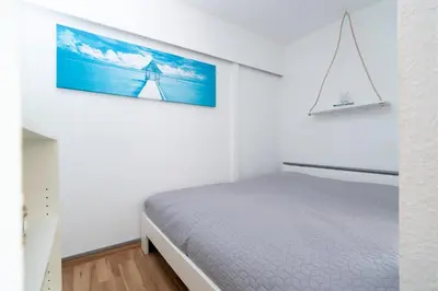 Ein Bett oder Betten in einem Zimmer der Unterkunft Panoramic Sierksdorf App C03-7