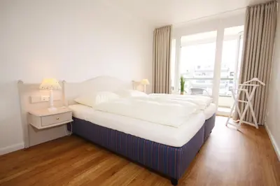 Ein Bett oder Betten in einem Zimmer der Unterkunft Meer & Strand - Haus Meeresstrand Ferienwohnung 313