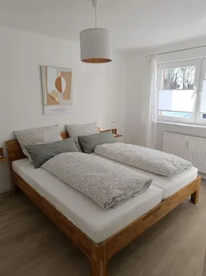 Ein Bett oder Betten in einem Zimmer der Unterkunft Strandnahe Ferienwohnung