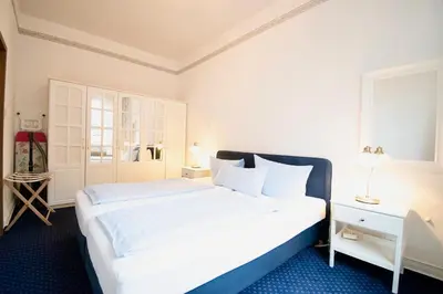 Ein Bett oder Betten in einem Zimmer der Unterkunft Villa Wilhelma Strandallee 146 Villa Wilhelma Apartment 6