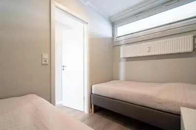 Ein Bett oder Betten in einem Zimmer der Unterkunft Ferienpark Sierksdorf App 88