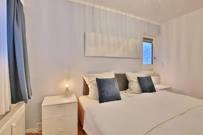 Ein Bett oder Betten in einem Zimmer der Unterkunft Residenz am Hang Küstenklang Appartement 110