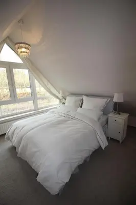 Ein Bett oder Betten in einem Zimmer der Unterkunft Hamptons House