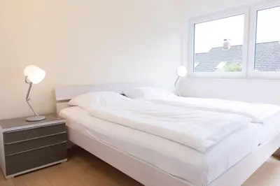 Ein Bett oder Betten in einem Zimmer der Unterkunft MEI11 Ferienwohung Küstelodge