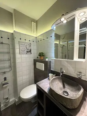 Ein Badezimmer in der Unterkunft Ferienwohnung Strandperle - nur 150m zum Strand