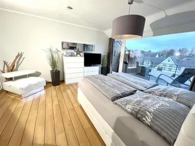 Ein Bett oder Betten in einem Zimmer der Unterkunft Ferienwohnung Strandperle - nur 150m zum Strand
