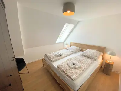 Ein Bett oder Betten in einem Zimmer der Unterkunft Timmenhus - neue Ferienwohnungen im historischen Bauernhaus