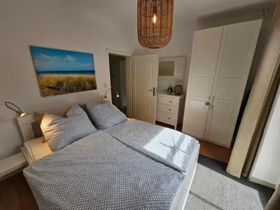 Ein Bett oder Betten in einem Zimmer der Unterkunft Ferienwohnung Raphael Timmendorfer Strand Gorch-Fock-Straße