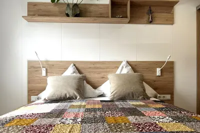 Ein Bett oder Betten in einem Zimmer der Unterkunft Ostseecamp Ferienhaus 