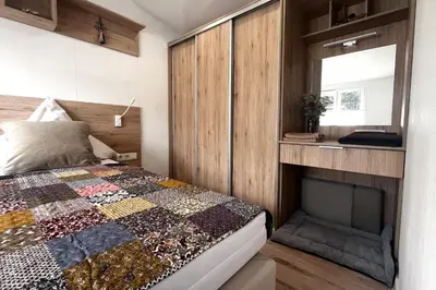 Ein Bett oder Betten in einem Zimmer der Unterkunft Ostseecamp Ferienhaus 