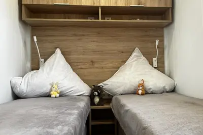 Ein Bett oder Betten in einem Zimmer der Unterkunft Ostseecamp Ferienhaus 