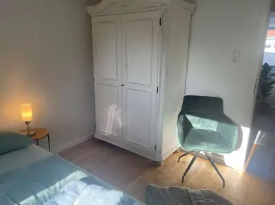 Ein Bett oder Betten in einem Zimmer der Unterkunft Hanseglück-hübsche FeWo am Altstadtrand mit Wifi