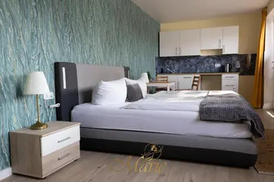 Ein Bett oder Betten in einem Zimmer der Unterkunft Gästehaus Marie