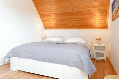 Ein Bett oder Betten in einem Zimmer der Unterkunft Steenkamp 32 Aus-Zeit