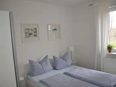 Ein Bett oder Betten in einem Zimmer der Unterkunft Strandrausch Comfortable holiday residence