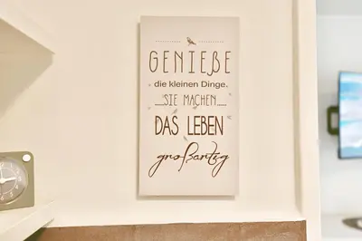 Ein Zertifikat, Auszeichnung, Logo oder anderes Dokument, das in der Unterkunft BeachLife Appartement 10 ausgestellt ist