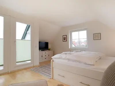 Ein Bett oder Betten in einem Zimmer der Unterkunft Haus am Meer