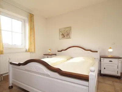 Ein Bett oder Betten in einem Zimmer der Unterkunft Ostseeblick Ferienhaus