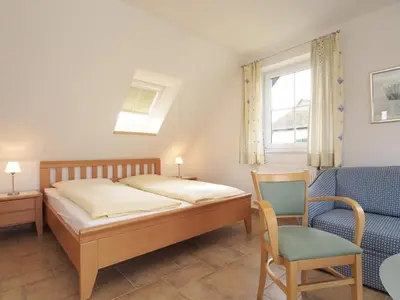 Ein Bett oder Betten in einem Zimmer der Unterkunft Ostseeblick Ferienhaus