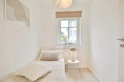 Ein Bett oder Betten in einem Zimmer der Unterkunft Ferienanlage Poststraße 41 Appartement 3 Emil