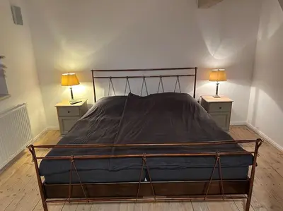 Ein Bett oder Betten in einem Zimmer der Unterkunft Maurine im alten Speicher
