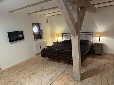 Ein Bett oder Betten in einem Zimmer der Unterkunft Maurine im alten Speicher