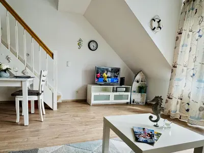 Ein Sitzbereich in der Unterkunft Ferienwohnung in Timmendorfer Strand, Niendorf an der Ostsee