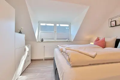 Ein Bett oder Betten in einem Zimmer der Unterkunft Haus Augustushof