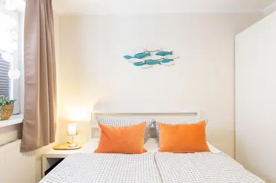 Ein Bett oder Betten in einem Zimmer der Unterkunft Ferienwohnung Sanddorn - Scharbeutz