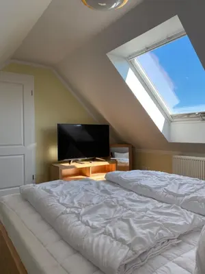 Ein Bett oder Betten in einem Zimmer der Unterkunft Haus zum Strand Seestern