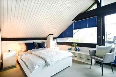 Ein Bett oder Betten in einem Zimmer der Unterkunft WOH15 Kapitänsresidenz